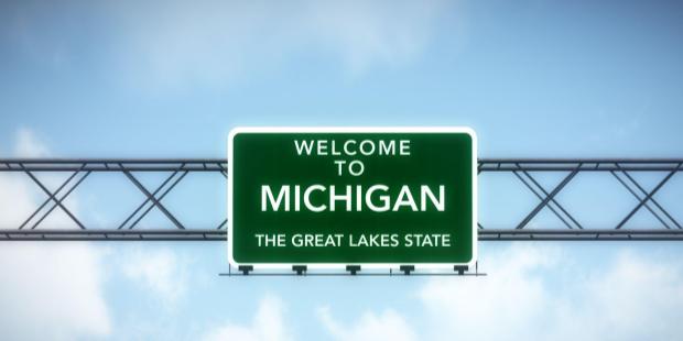 big, green sign welcoming people to Michigan, the Great Lake State