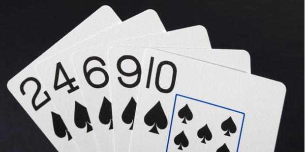 Five poker cards creating a flush combination. 