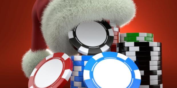 red Santa hat lying on a stack of poker chips