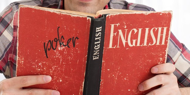 An English dictionary with the word Poker hand-written added to the title